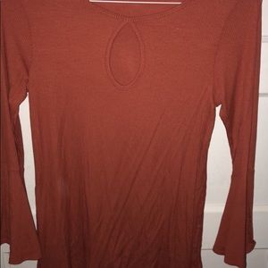 Ginger G key hole top, with large open sleeves.